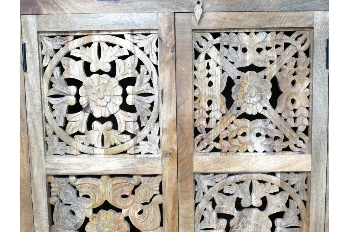 Carved wood cabinet doors with floral and geometric pattern detail