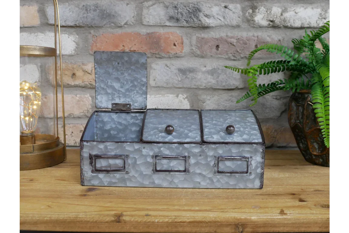 Galvanized metal kitchen storage box with three compartments on wooden surface