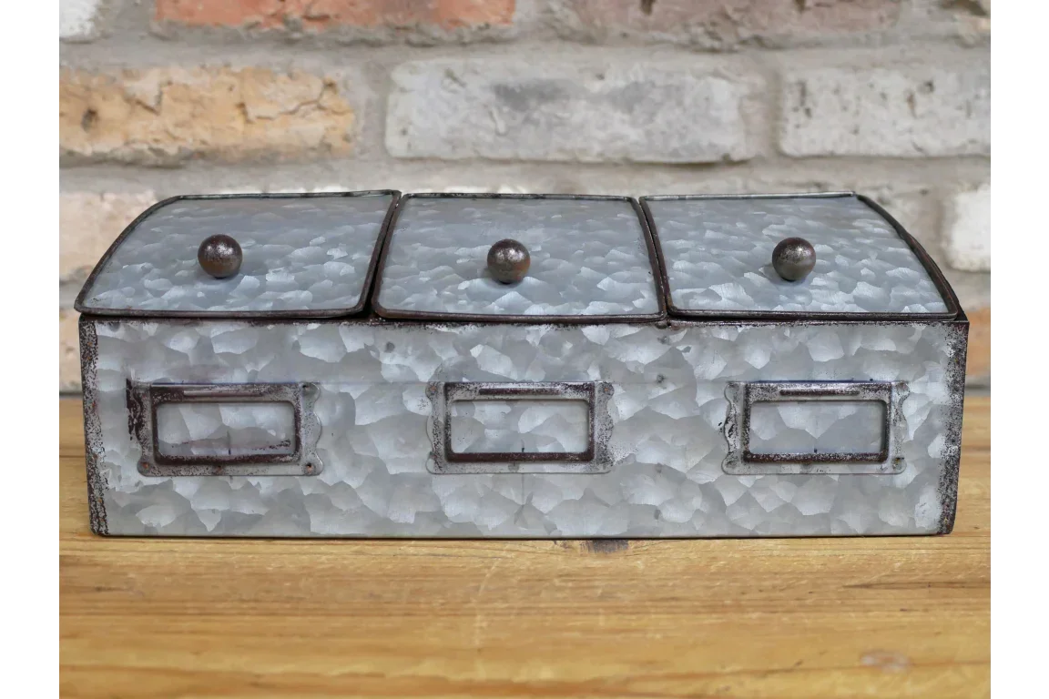 Galvanised metal kitchen storage box with three compartments on wooden surface