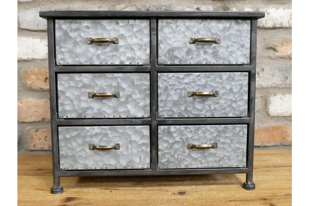 Industrial metal storage cabinet with six textured drawers and brass handles
