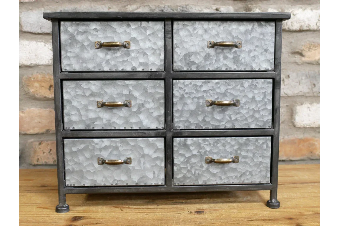 Industrial metal chest of drawers with six hammered silver drawers and gold handles