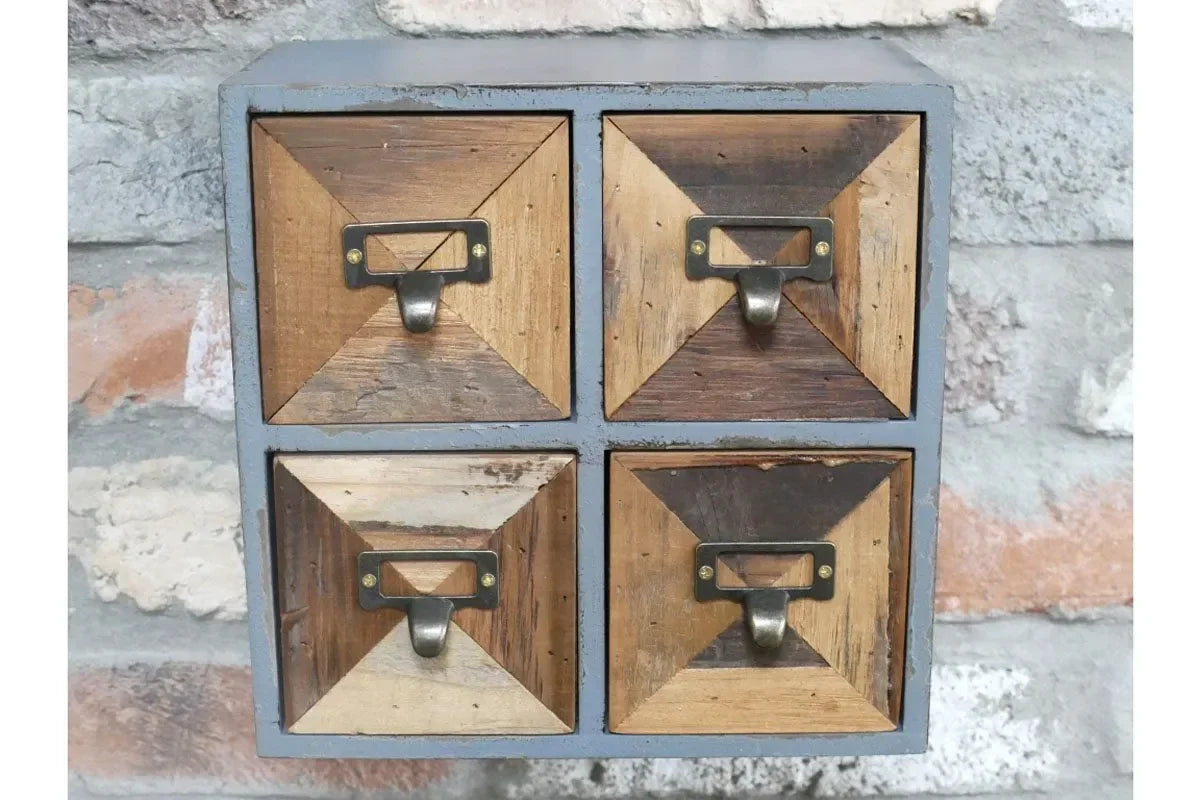 Rustic wooden mini storage drawers with metal handles mounted on brick wall