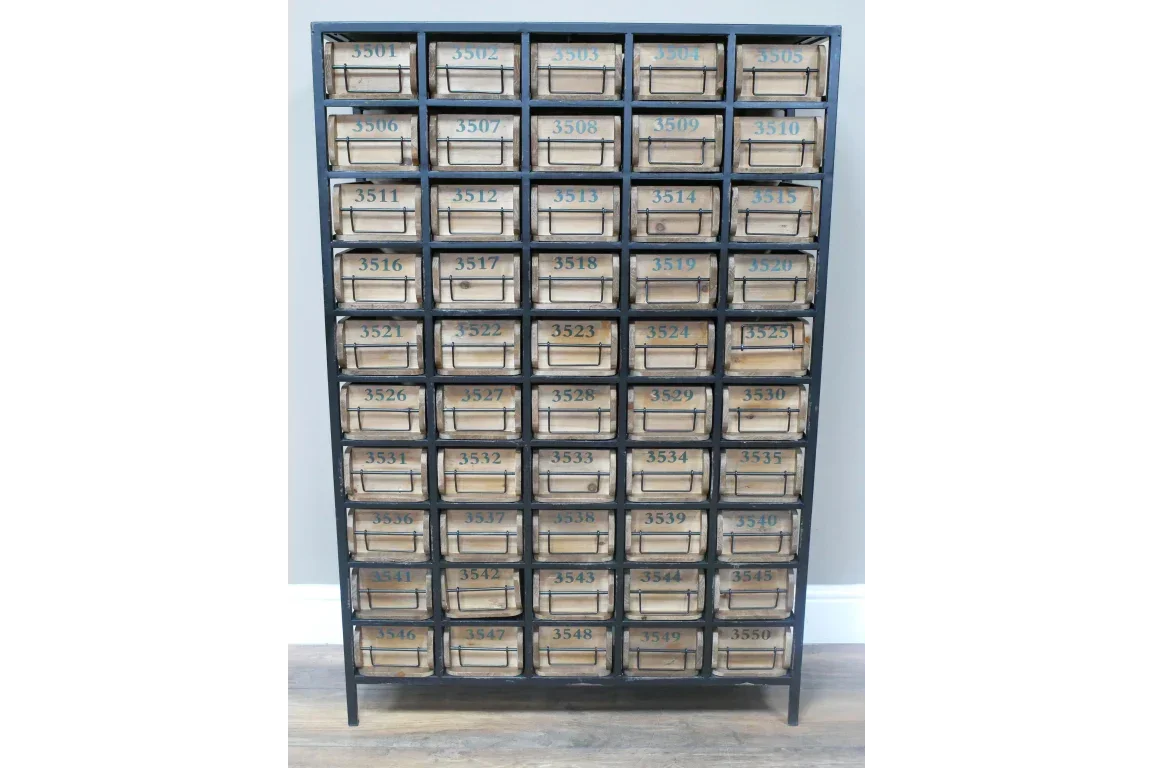 Industrial wooden storage cabinet with 40 numbered drawers and metal frame on wooden floor
