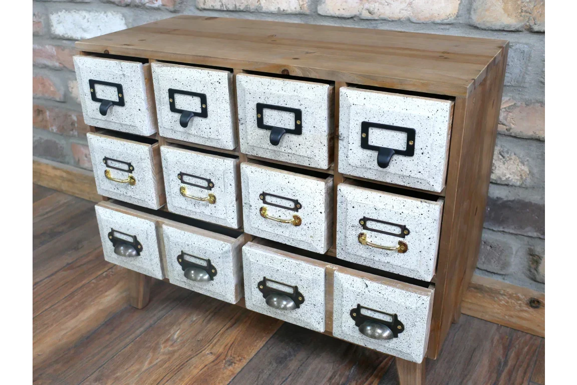 Wooden chest of drawers with twelve white speckled storage drawers and metal handles