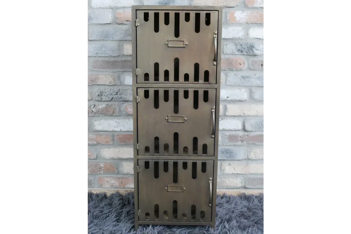 Industrial metal storage cabinet with three locker-style doors against brick wall