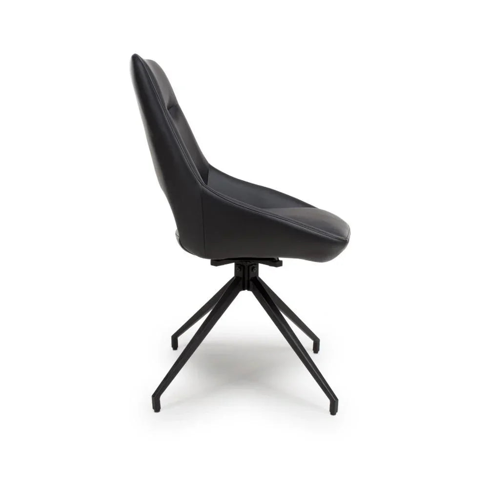 Black dining chair with padded seat and modern metal legs, side profile view