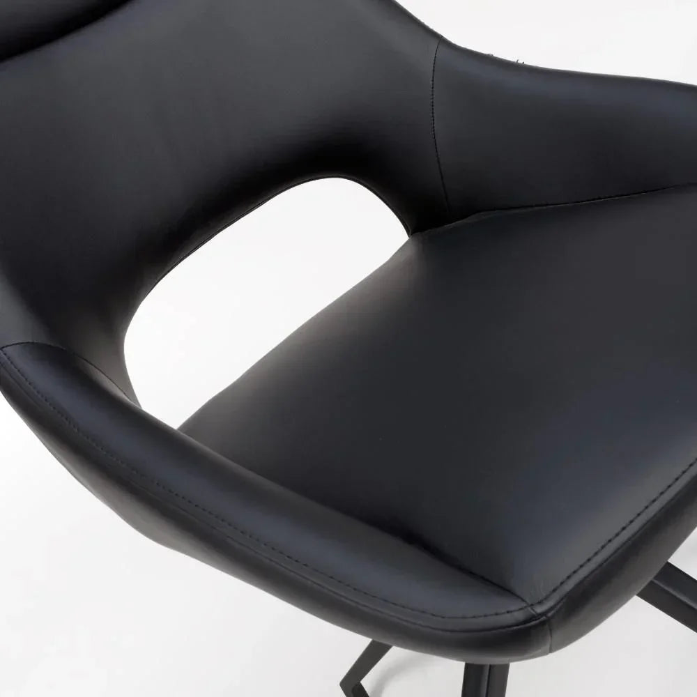 Black faux leather dining chair seat with curved back and cutout detail