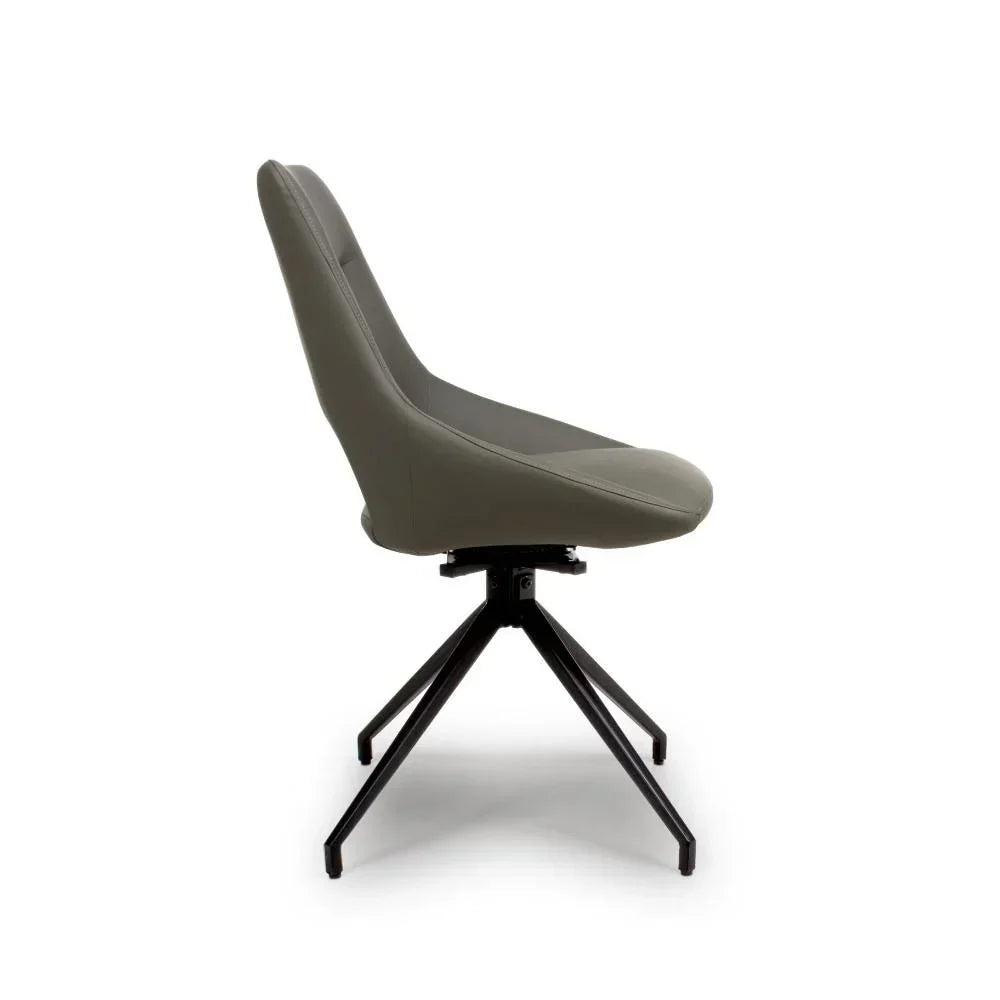 Side view of grey dining chair with swivel seat and black metal legs