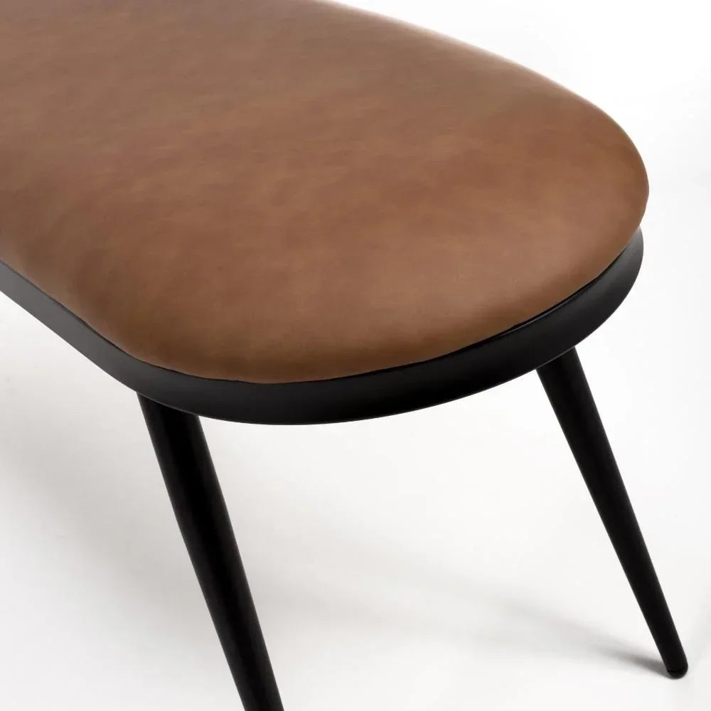 Brown faux leather dining bench seat with black metal legs, close-up angle