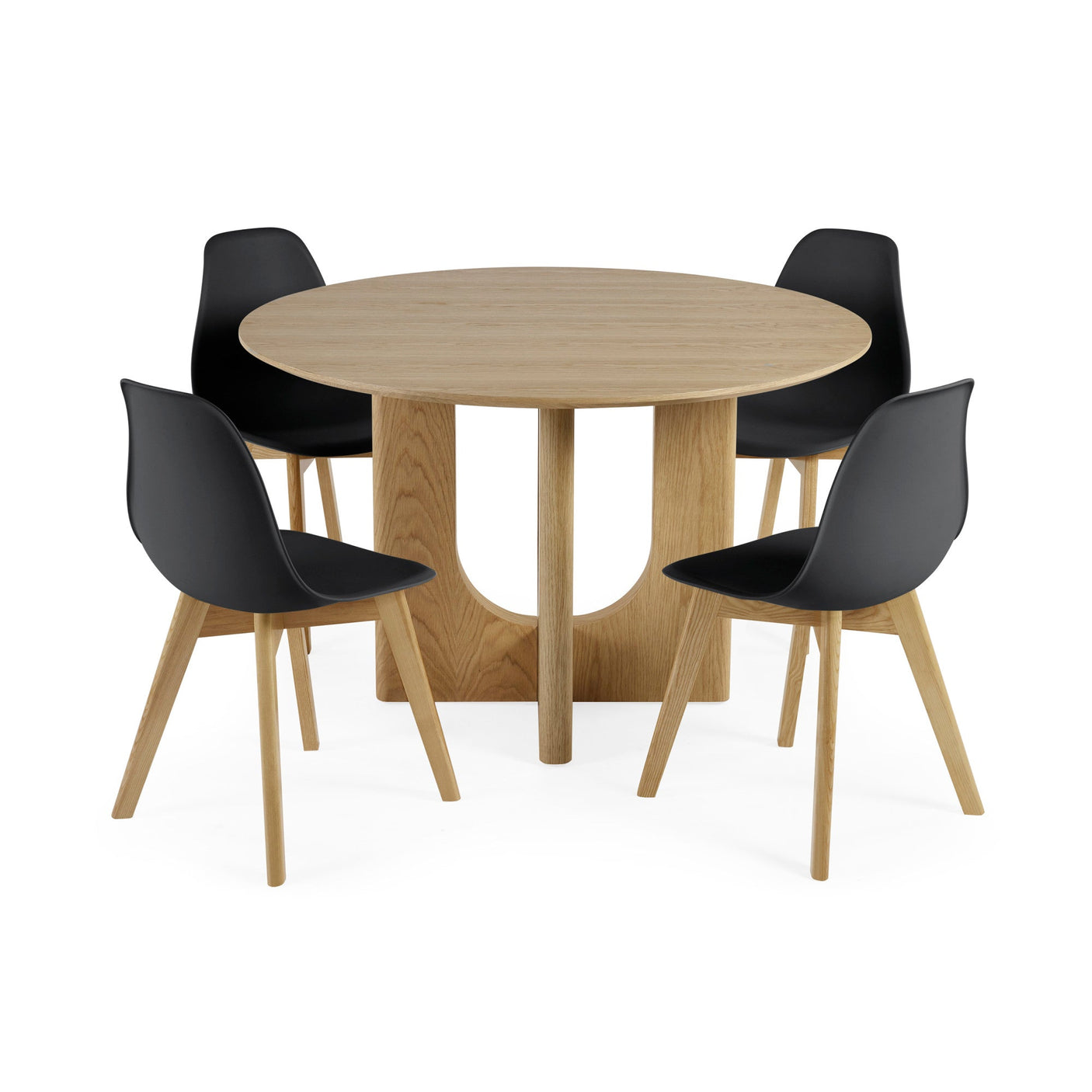 Four black plastic dining chairs with light wooden legs around round light oak table with solid base