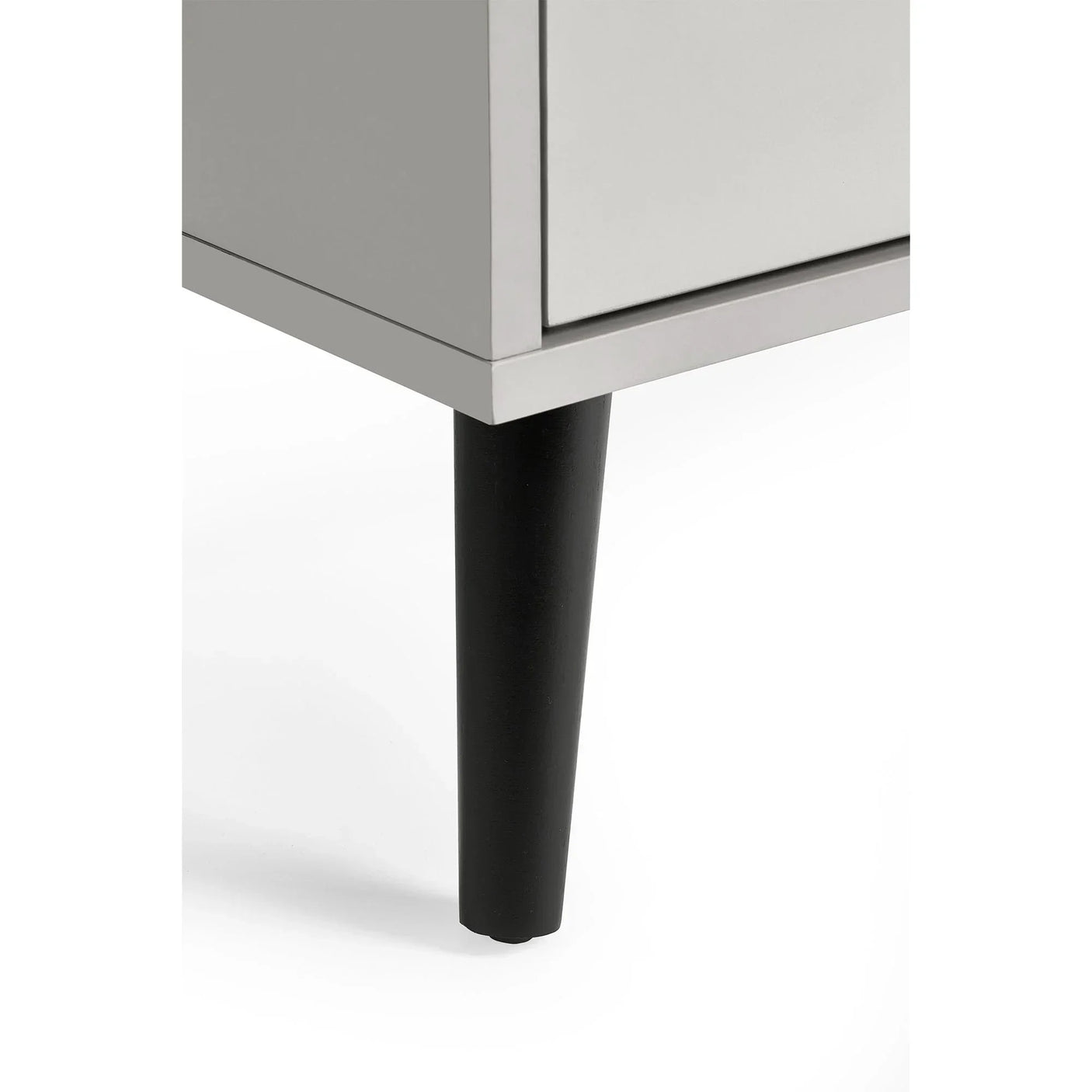 Silk grey chest of drawers corner with black tapered wooden leg detail