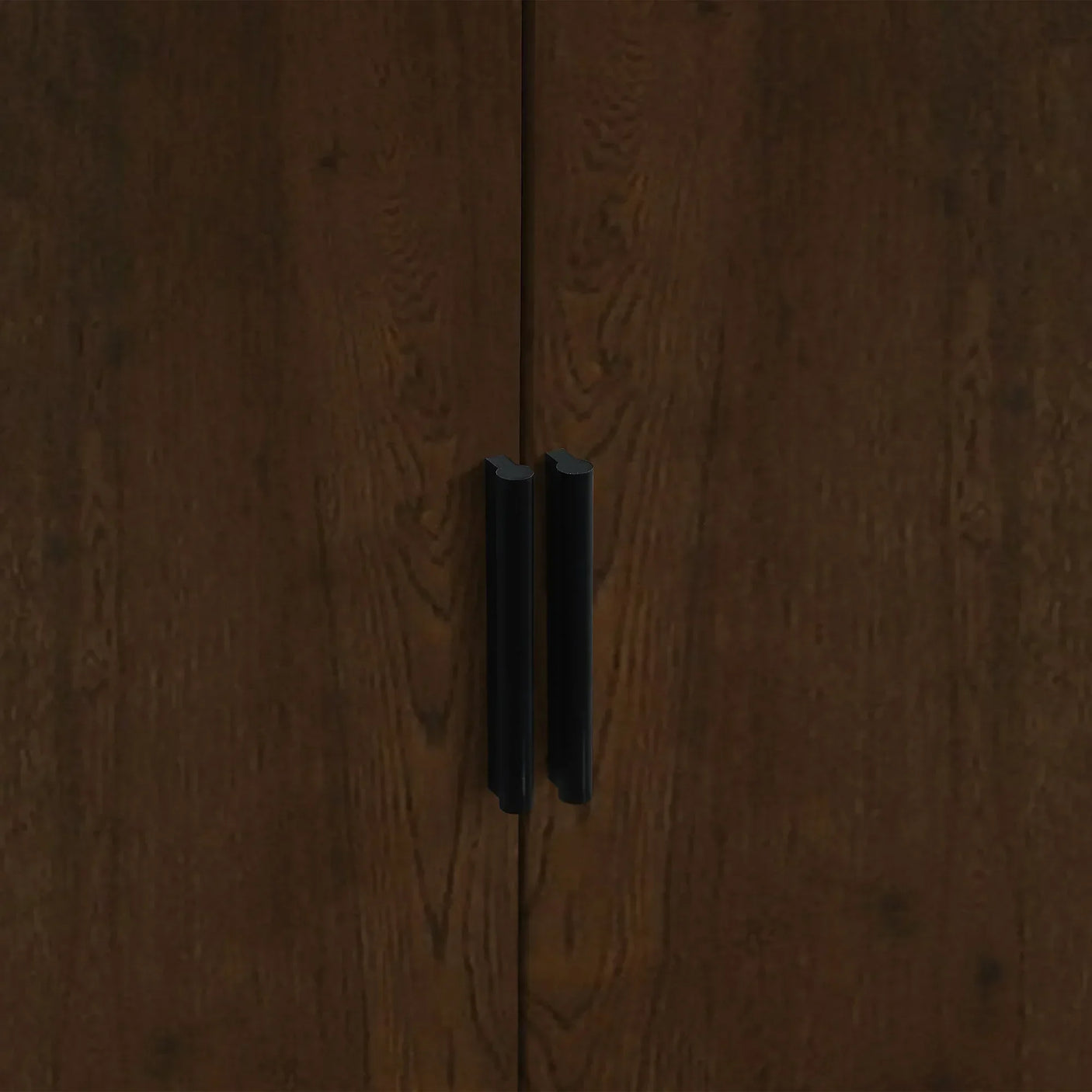 Walnut wardrobe doors with black handles close up
