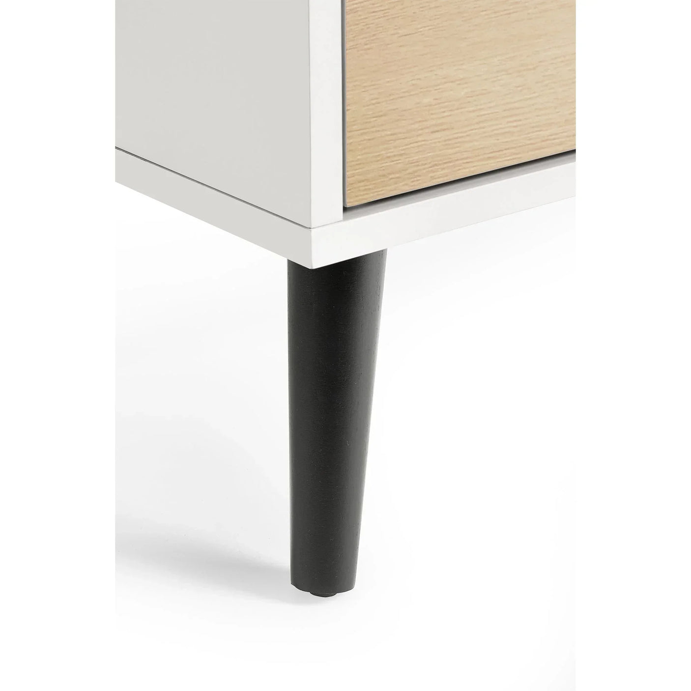 White and oak chest of drawers corner with black tapered leg detail