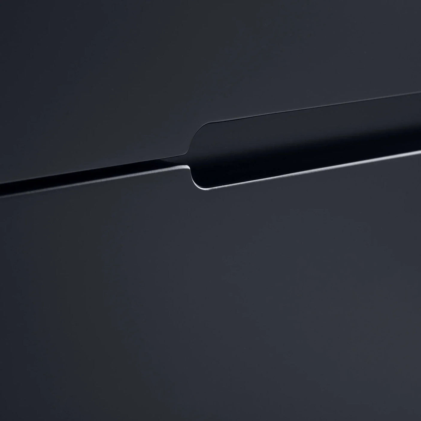 Anthracite chest of drawers close-up highlighting handle cutout and smooth matte finish