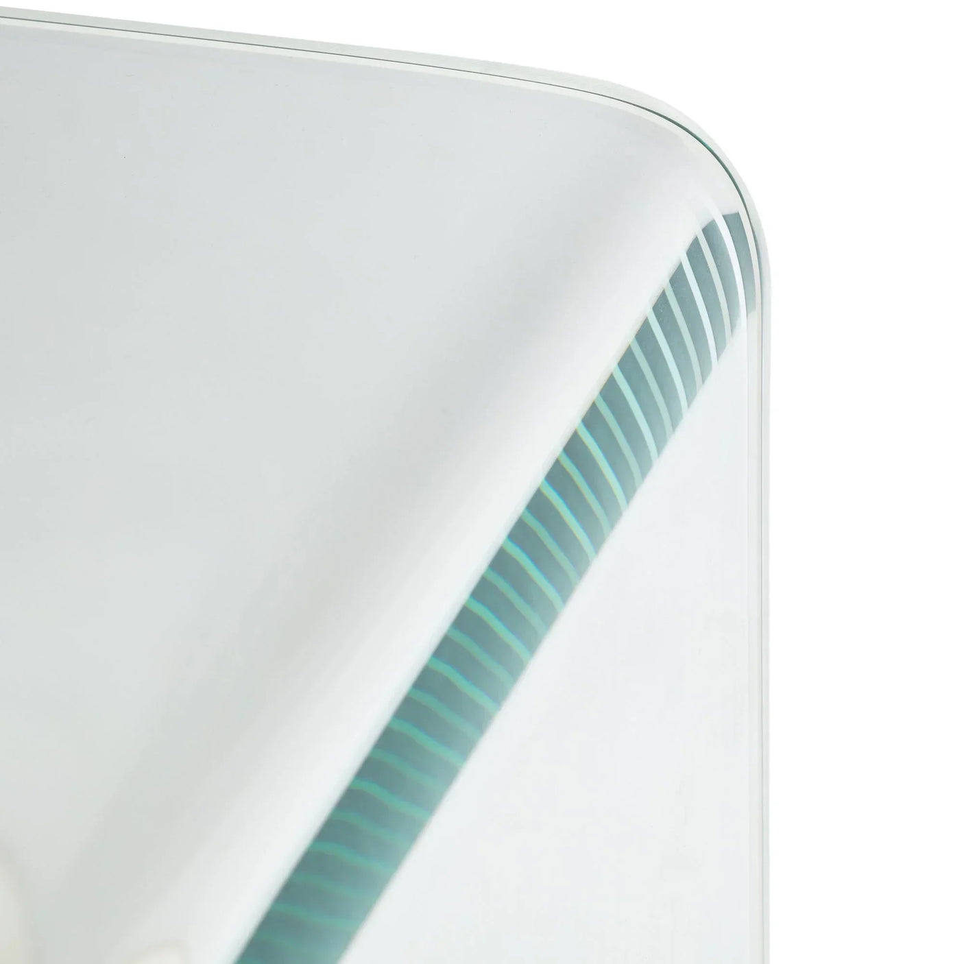 Closeup of glass desk top with curved edge and striped detailing