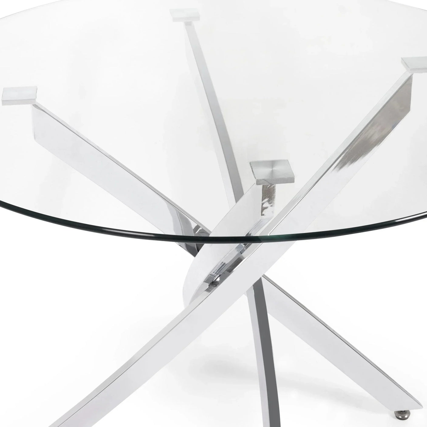 Round glass dining table with chrome crossed legs and clear tabletop detail