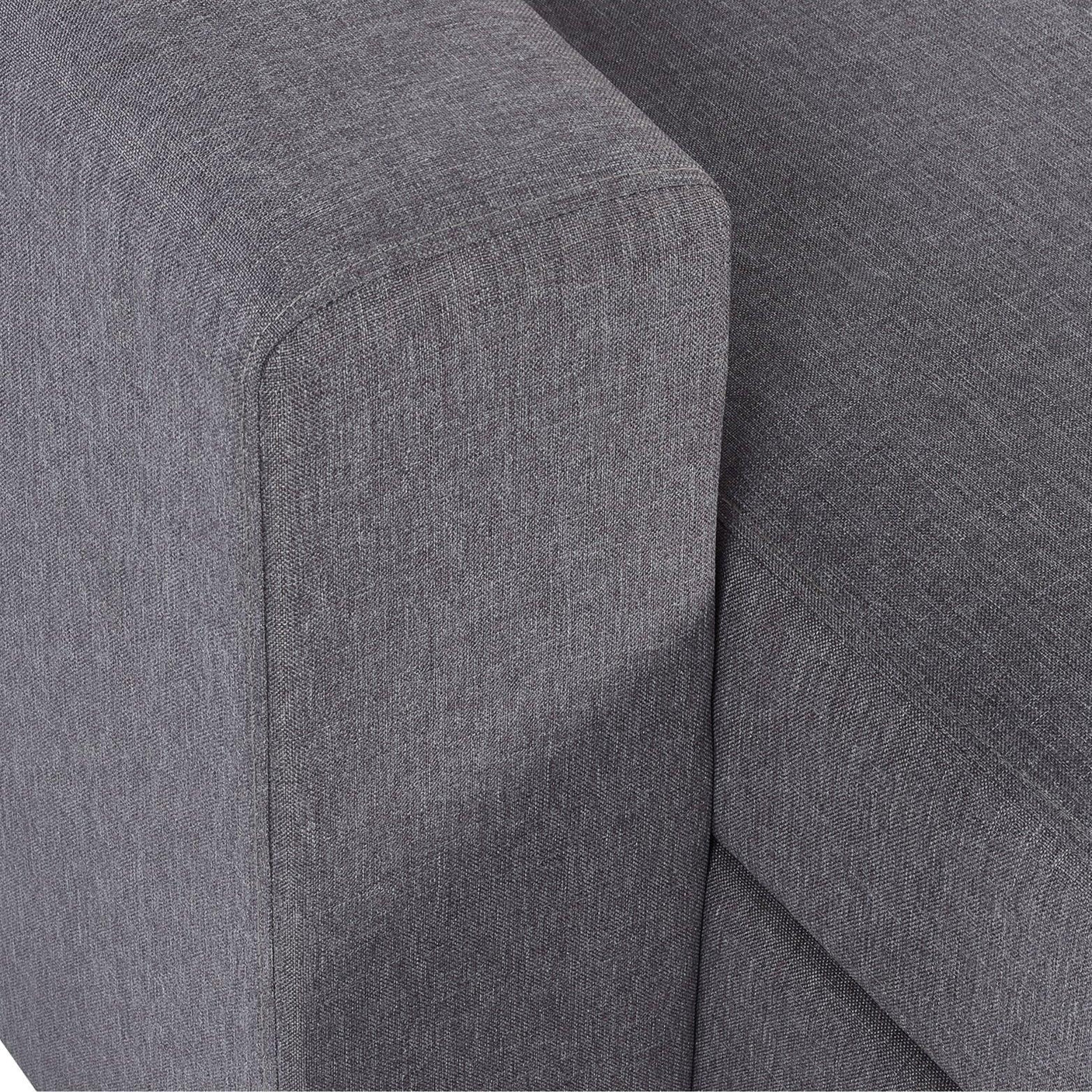 Close-up of grey fabric sofabed armrest and seat cushion