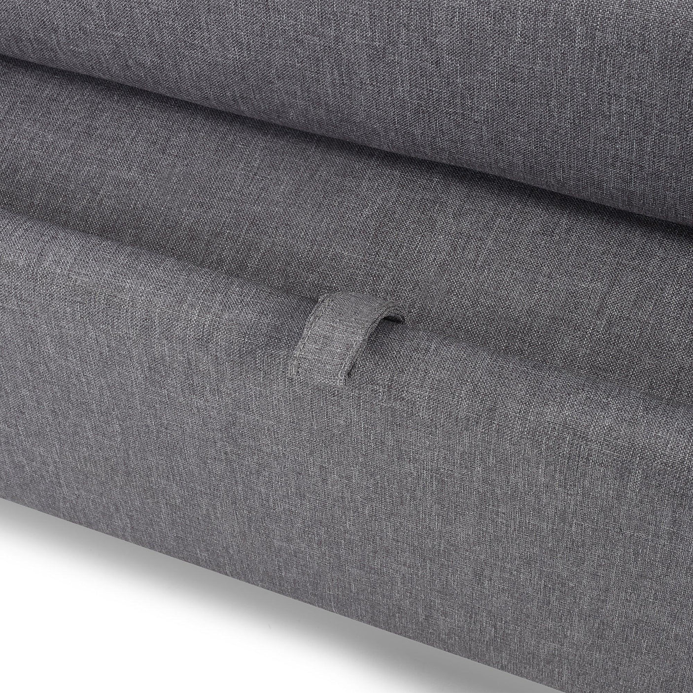 Closeup of grey fabric sofabed storage handle detail