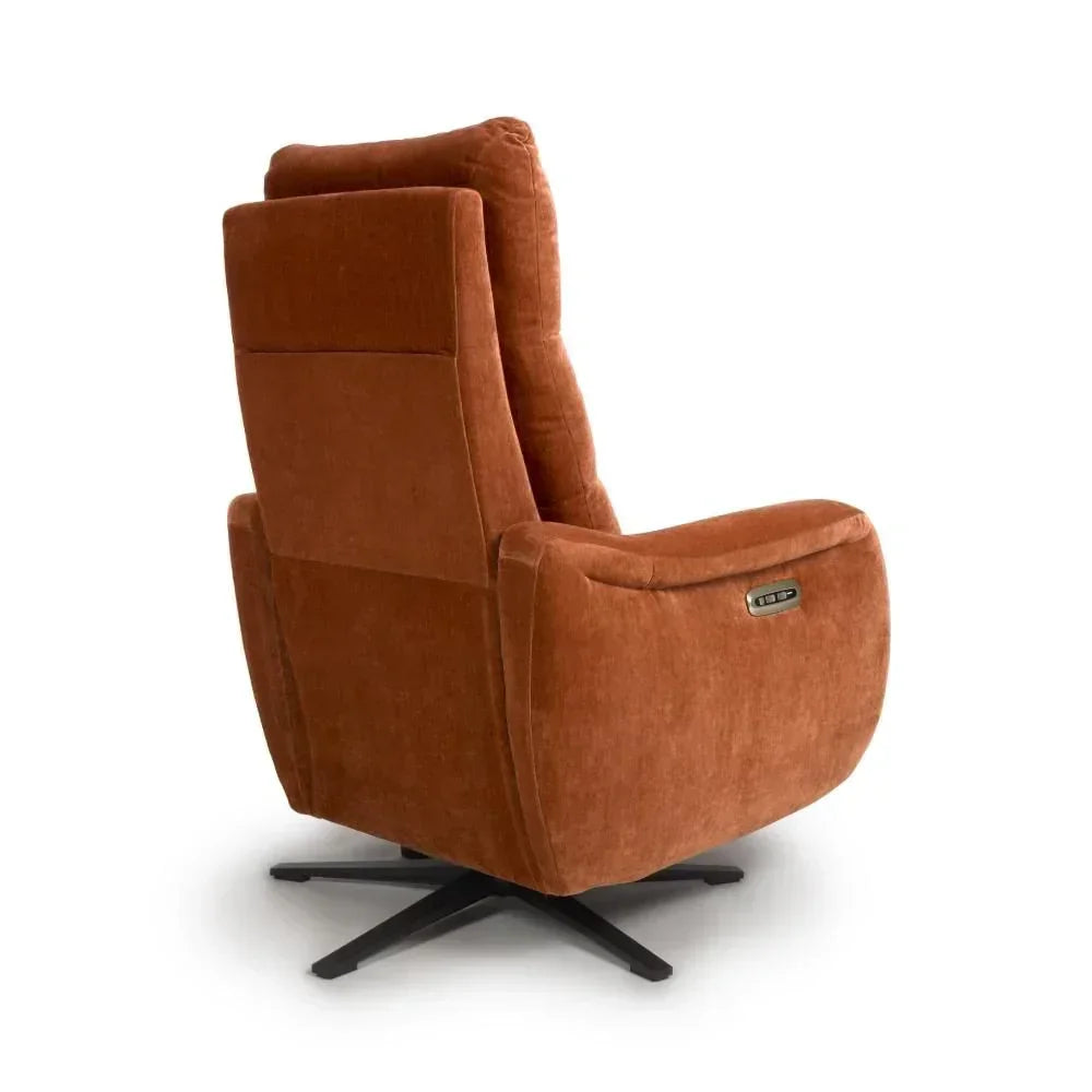 Rust fabric swivel recliner chair with high backrest and black metal base, rear angle view