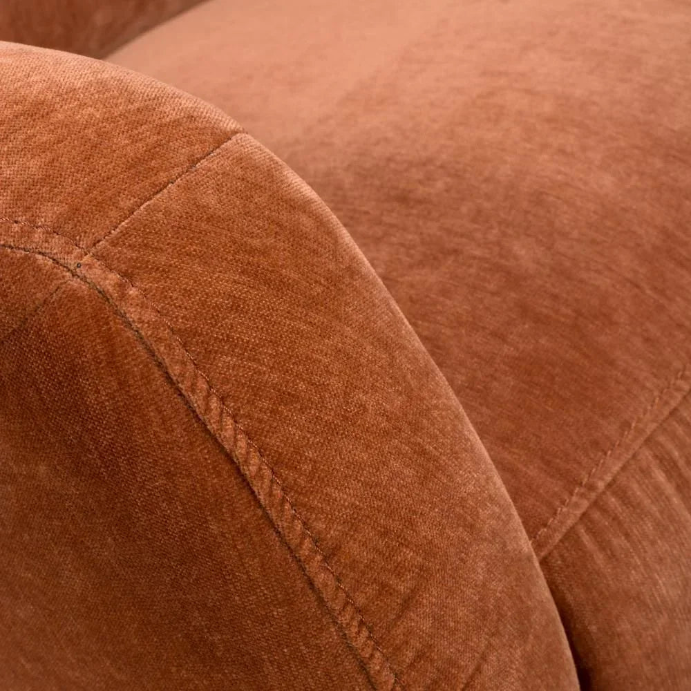 Close up of brown fabric sofa armrest with visible stitching detail