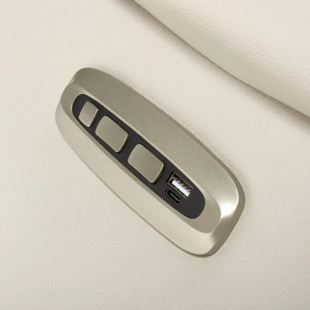Recliner sofa control panel with USB and USB-C ports on cream leather upholstery