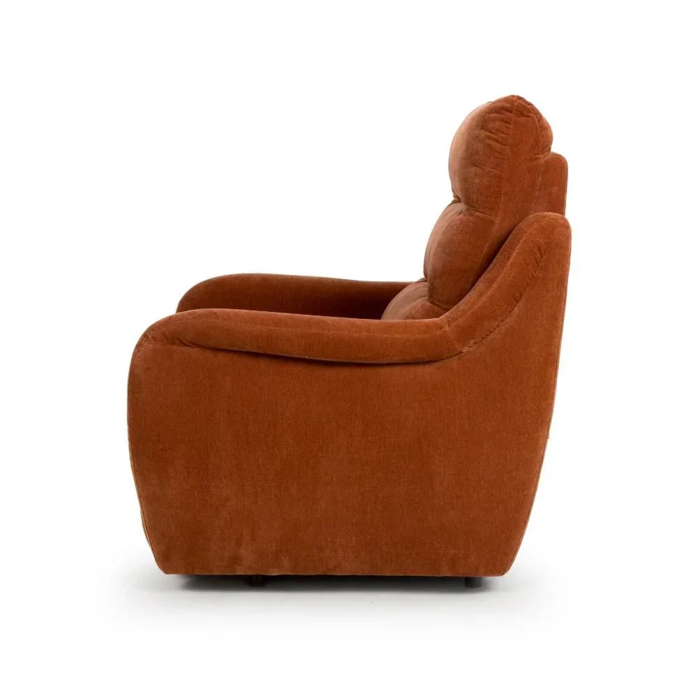 Side view of rust orange armchair with plush backrest and curved armrests