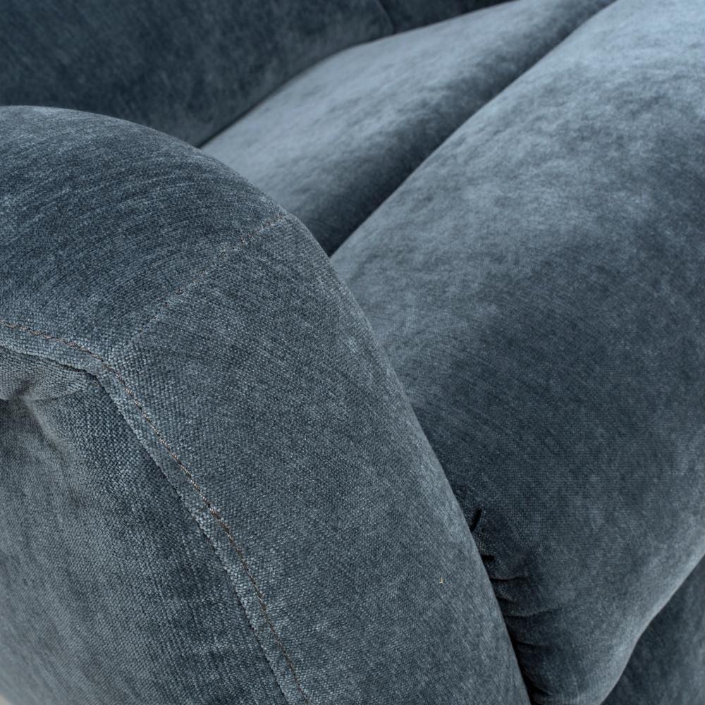 Closeup of dark grey fabric sofa armrest and seat cushion upholstery texture