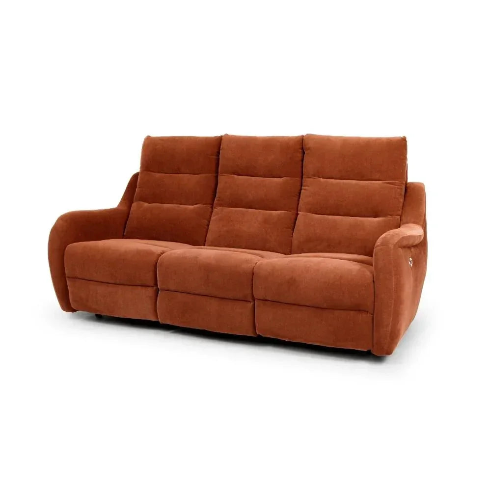 Three seater rust fabric sofa with padded seats and armrests on white background