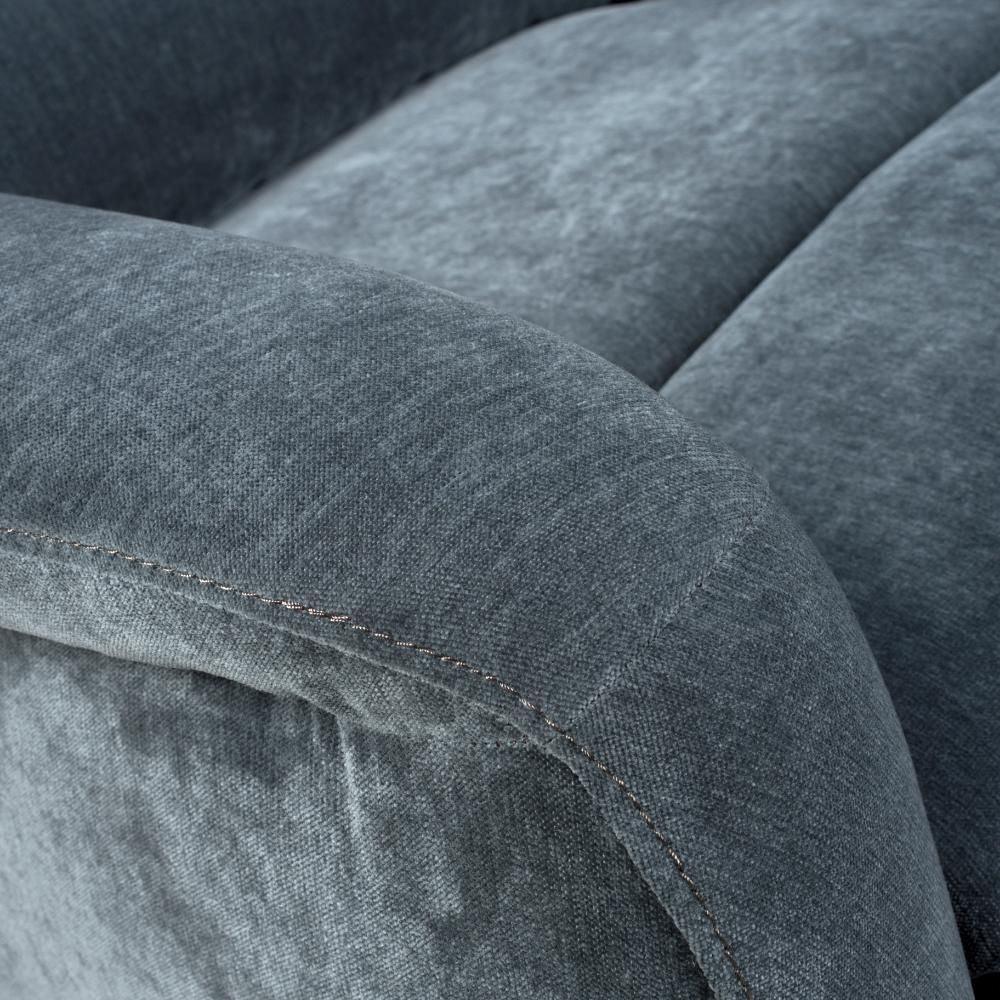 Close-up of grey fabric sofa armrest with visible stitching detail