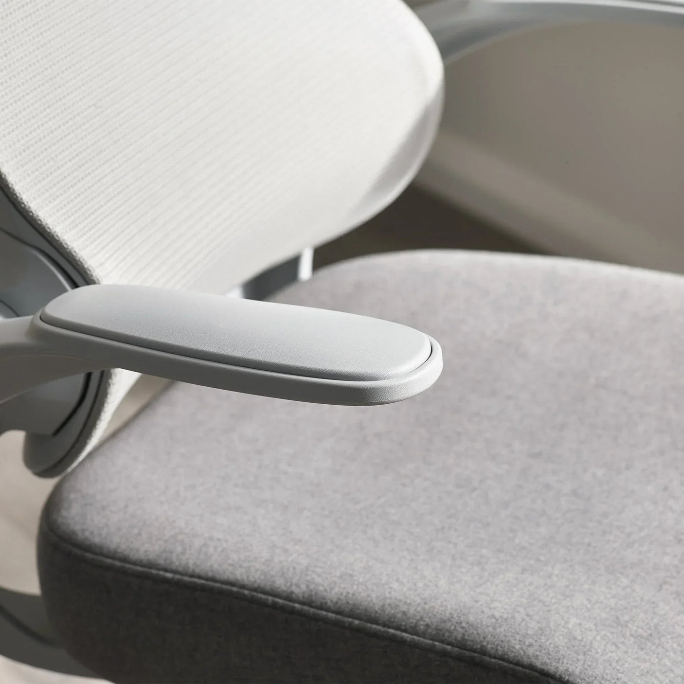 Archer office chair with padded armrest, grey fabric seat and light backrest detail