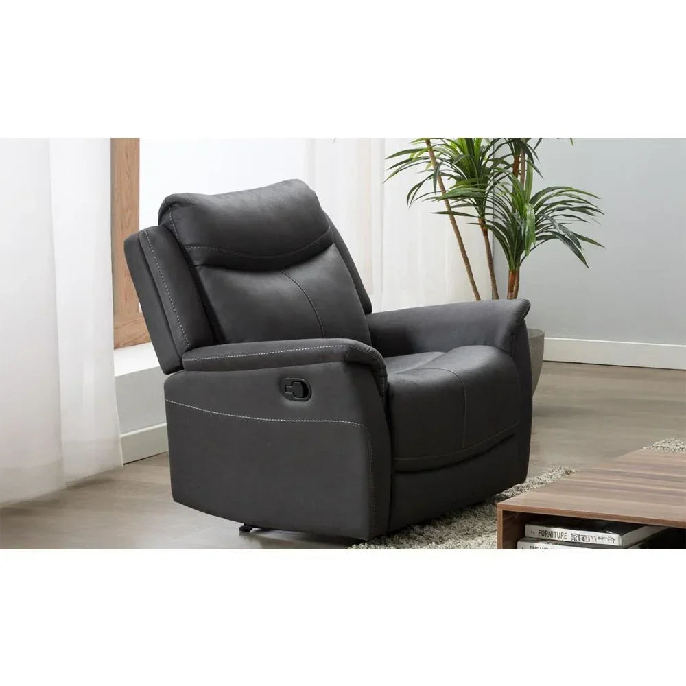 Dark grey recliner armchair with visible stitching in modern living room corner
