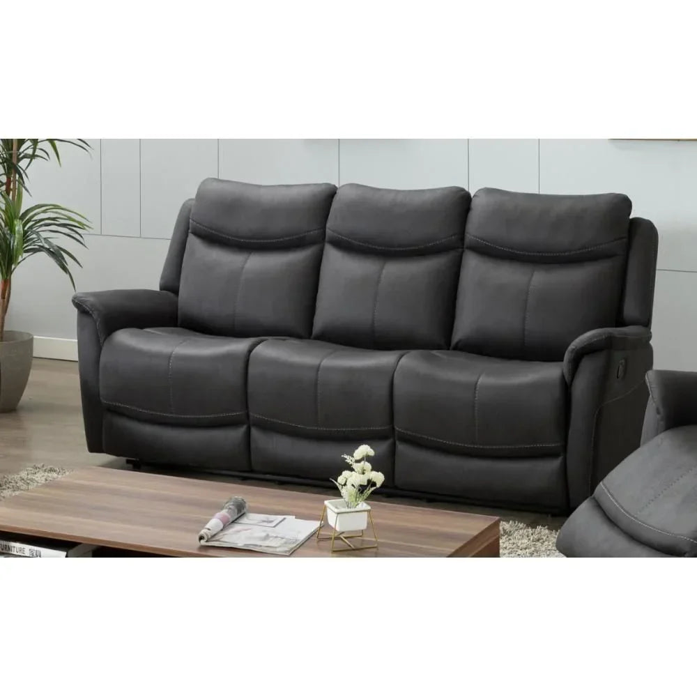 Dark grey reclining sofa with padded seats in modern living room setting