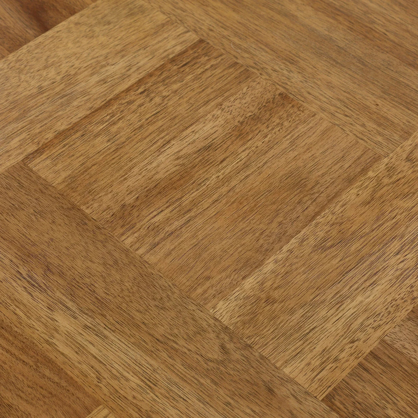 Closeup of oak wood dining table top with natural grain and parquet pattern