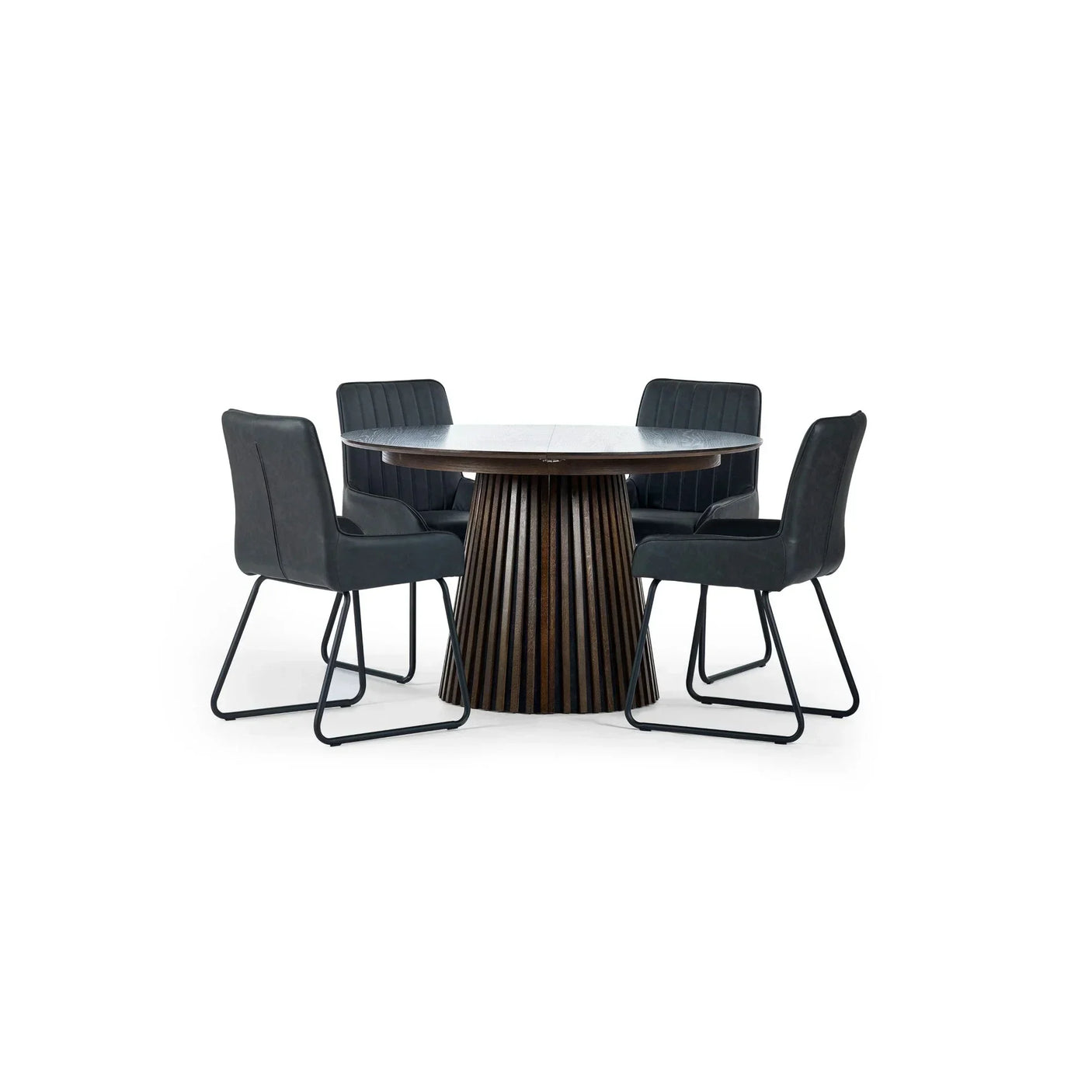 Round wood dining table with four black upholstered chairs on metal legs