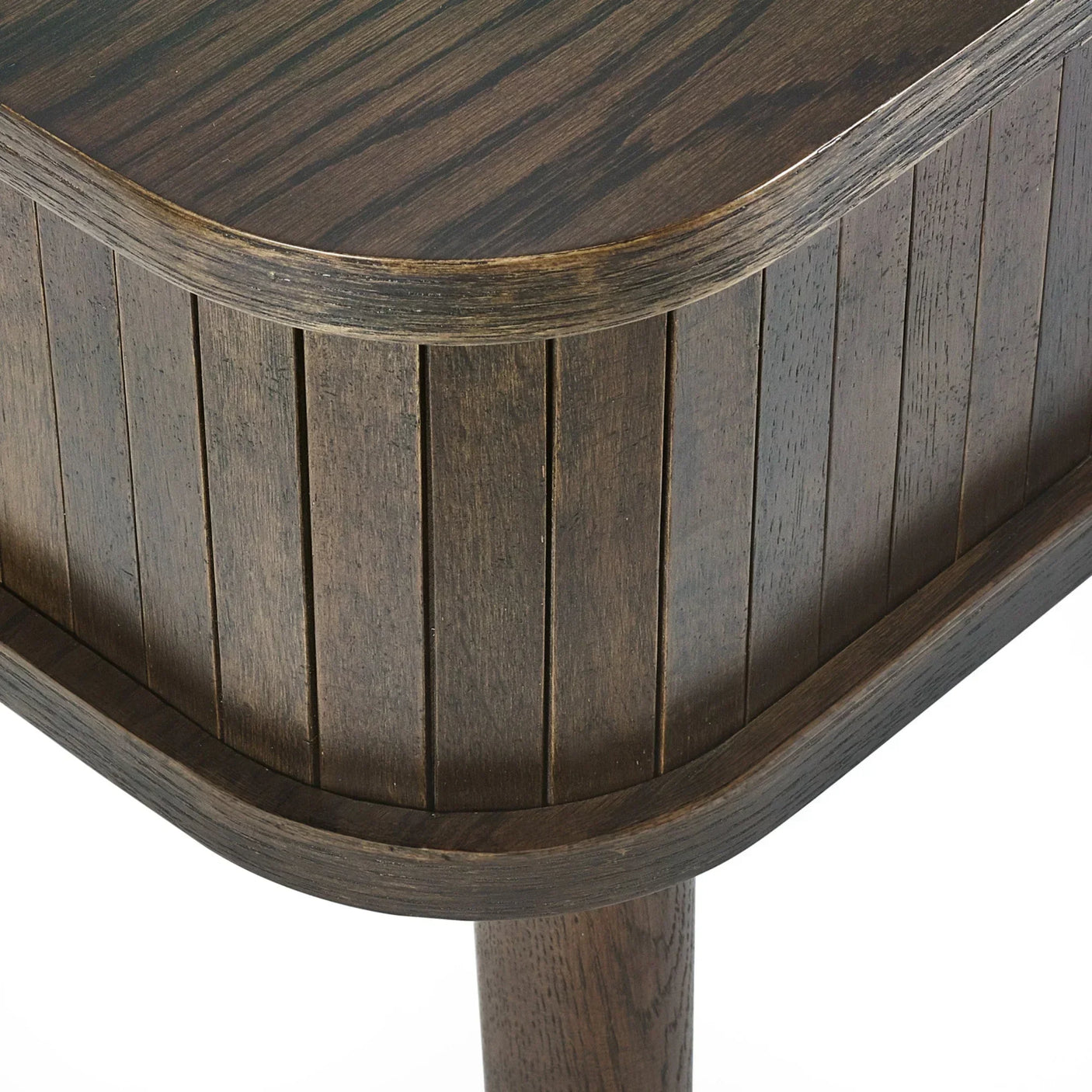 Close-up of dark wood side table with slatted panel design and rounded corner detail