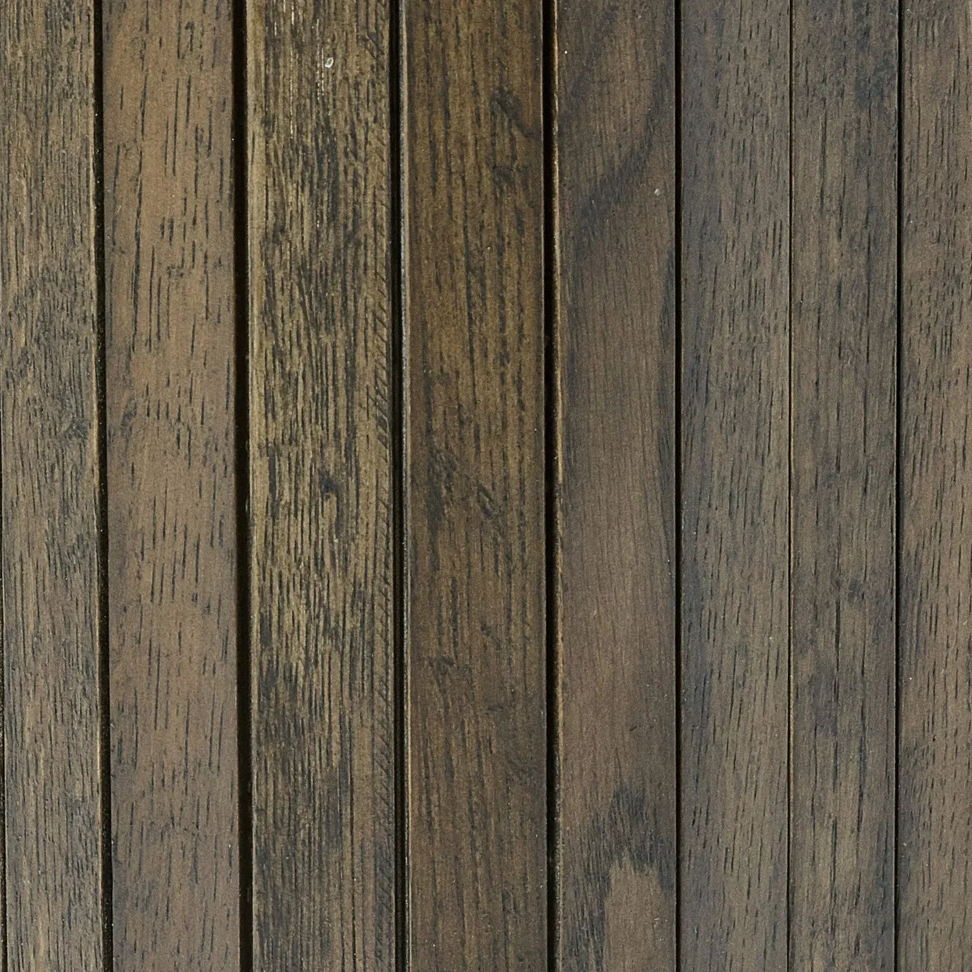 closeup of dark brown wooden slatted furniture panel with natural wood grain texture