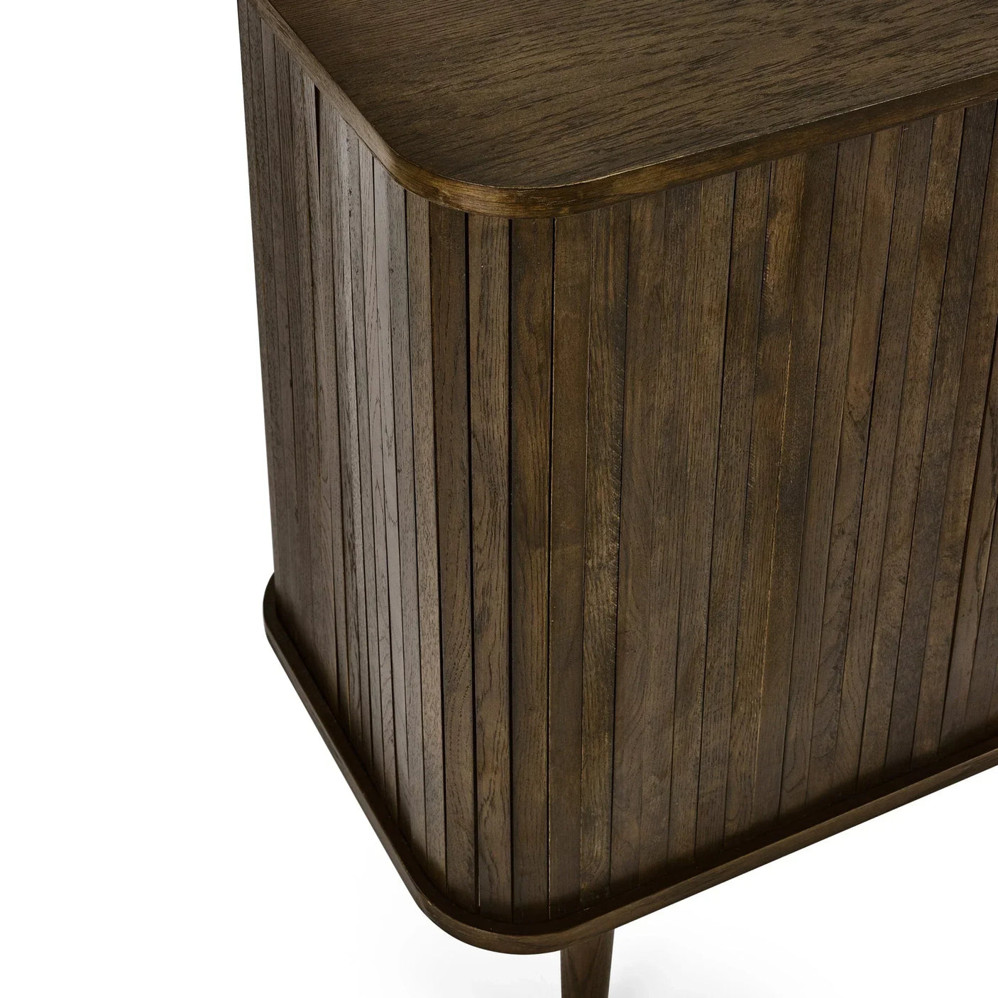 Close-up of wooden sideboard corner with vertical slatted panels and smooth dark finish