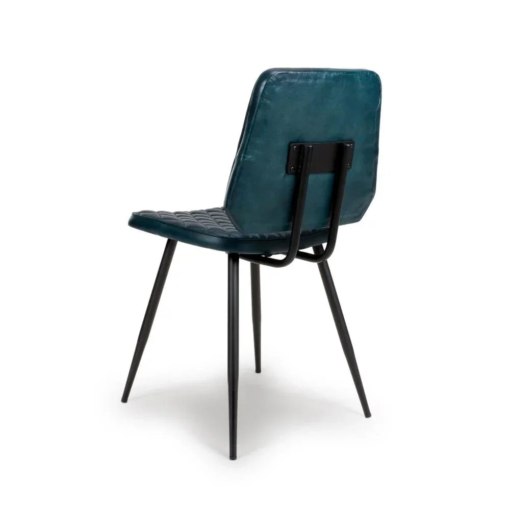 Blue leather dining chair with black metal legs, rear angled view