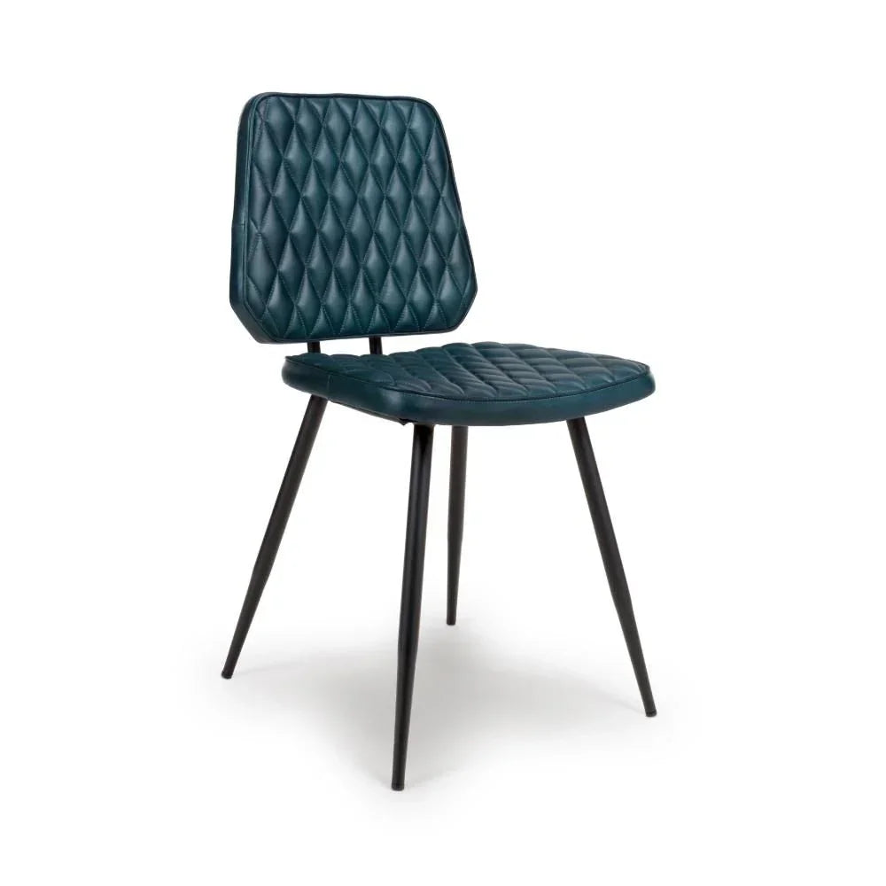 Blue quilted dining chair with black metal legs, angled side view