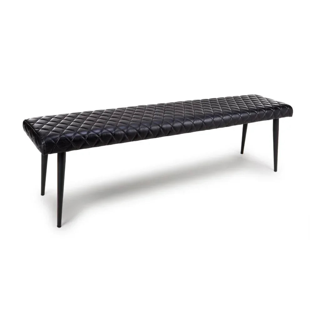 Black quilted leather bench with slim tapered legs, side angle view