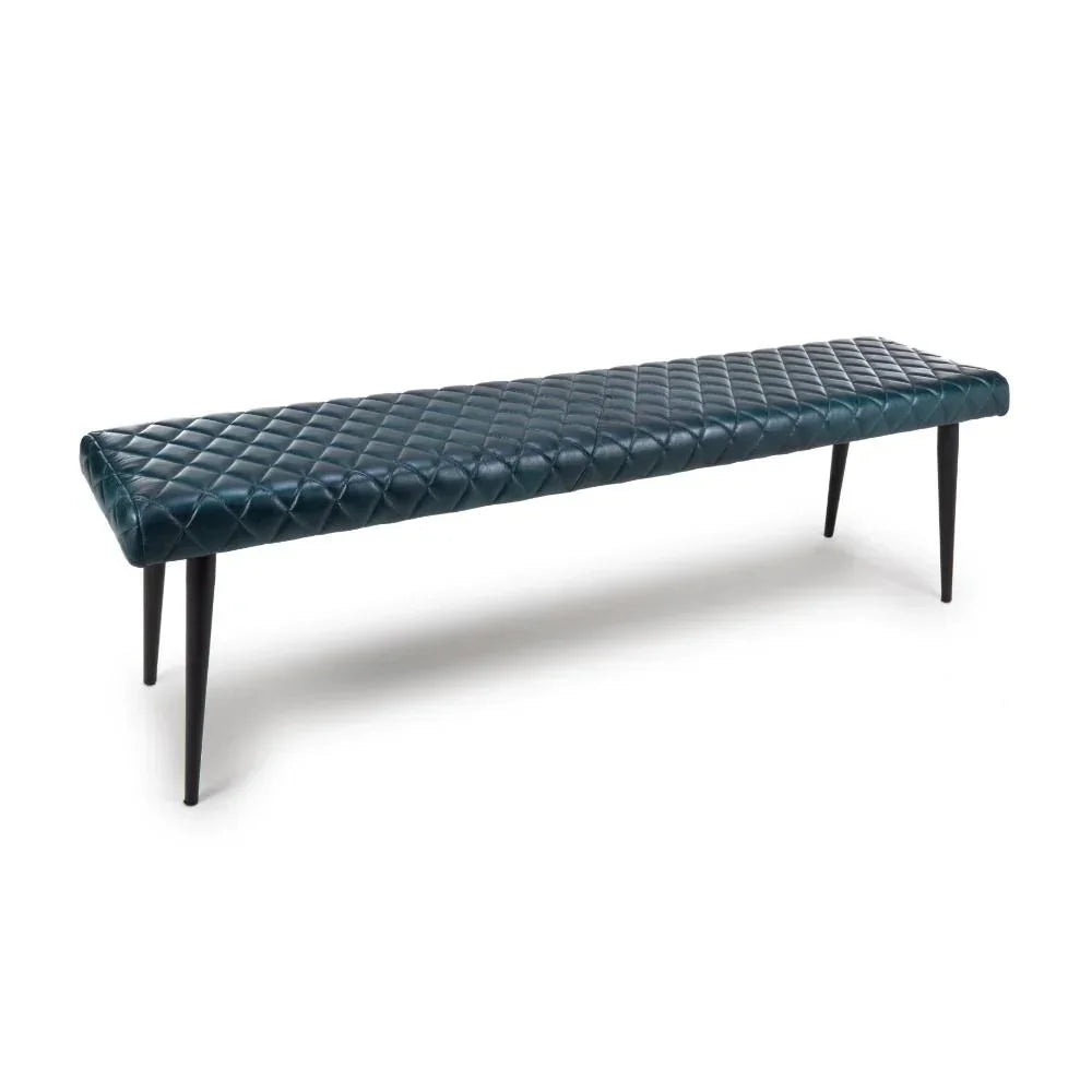 Blue quilted leather bench with black tapered legs, side angle view