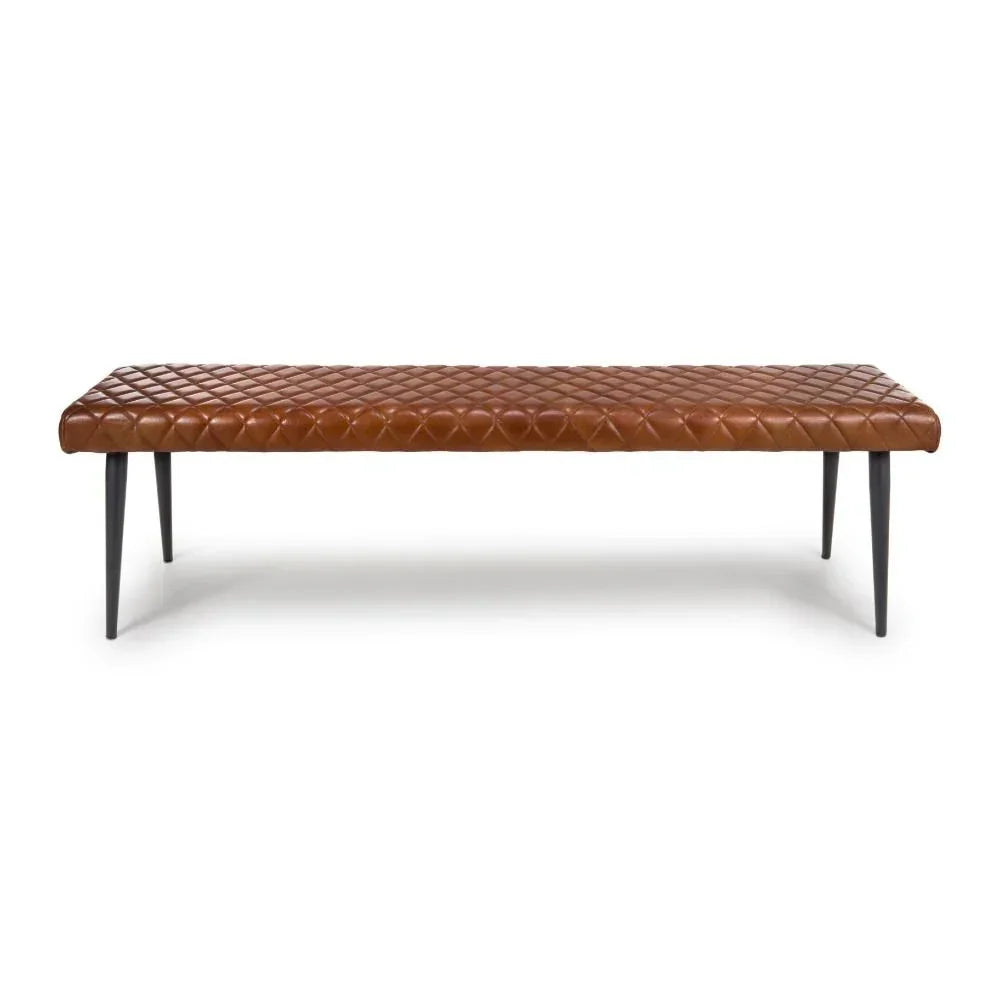 Brown leather bench with quilted seat and slim black legs, front view