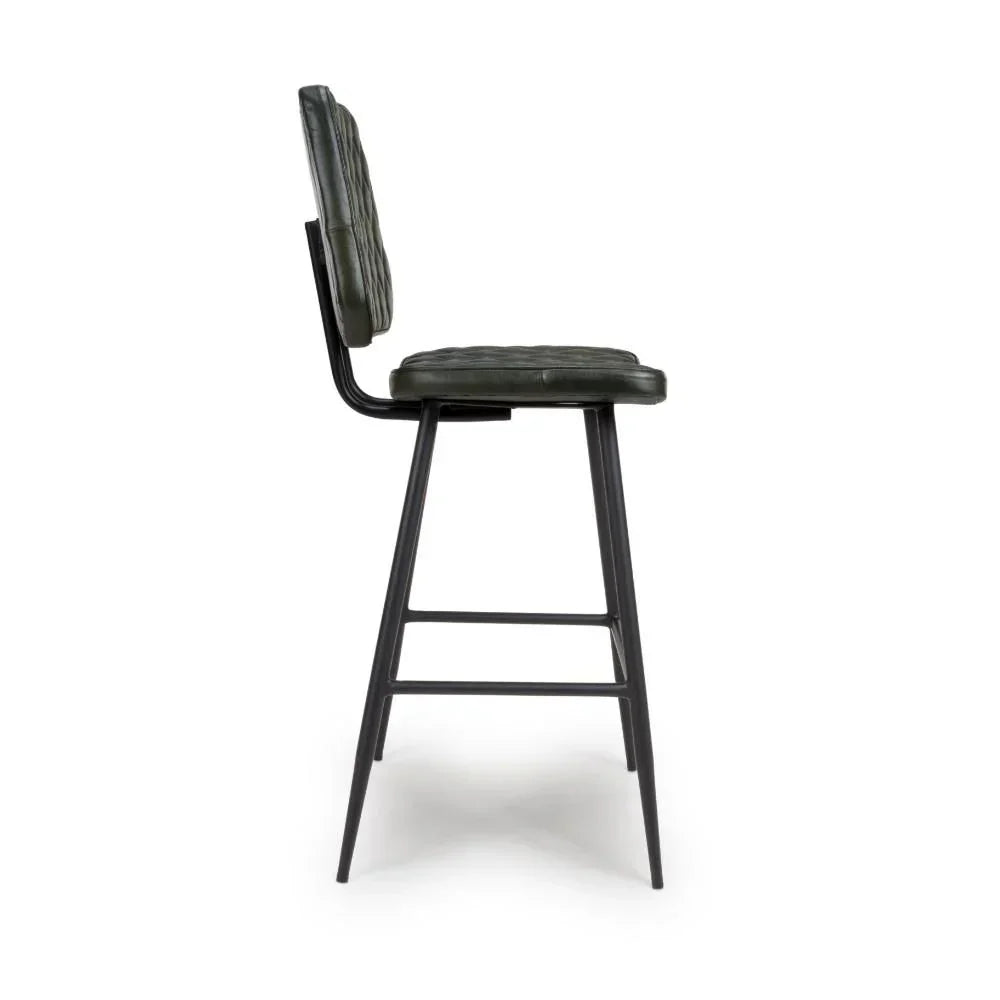 side view of green leather bar stool with black metal legs and padded backrest
