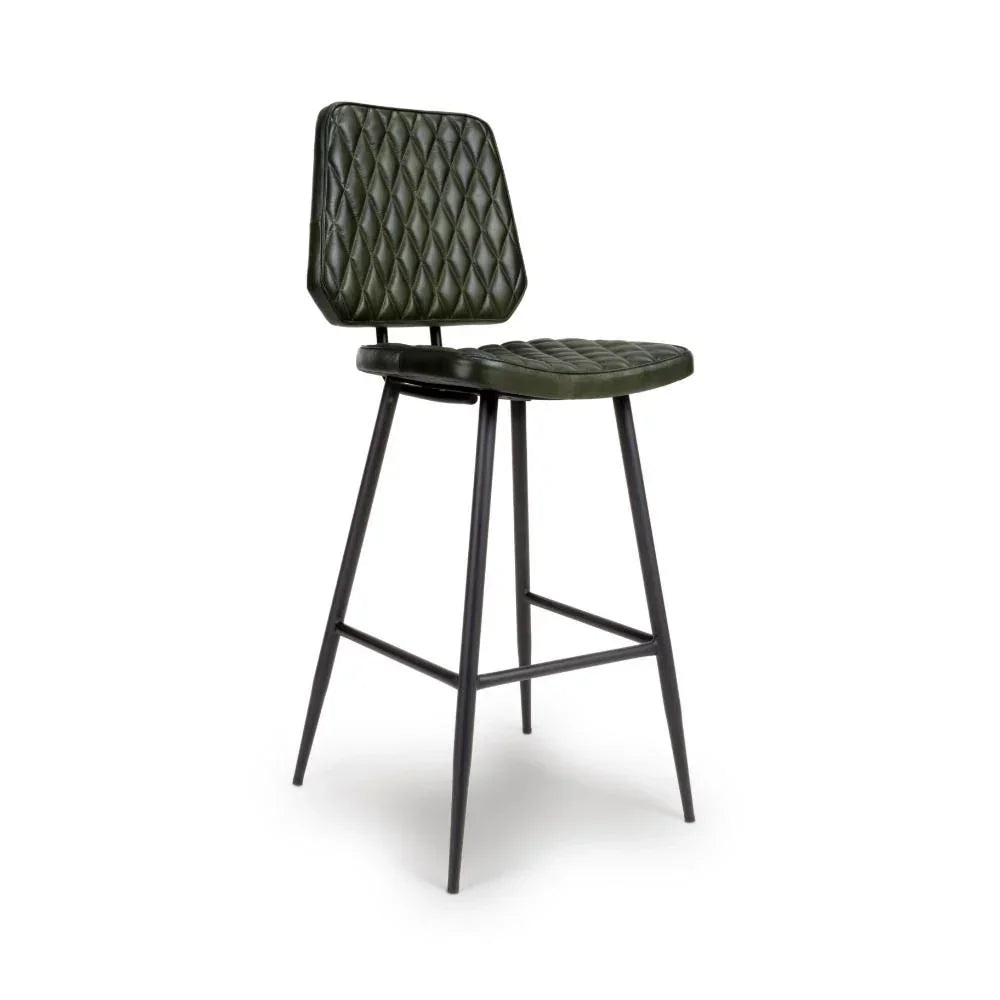 Green bar stool with diamond-stitched padded seat and back, black metal legs