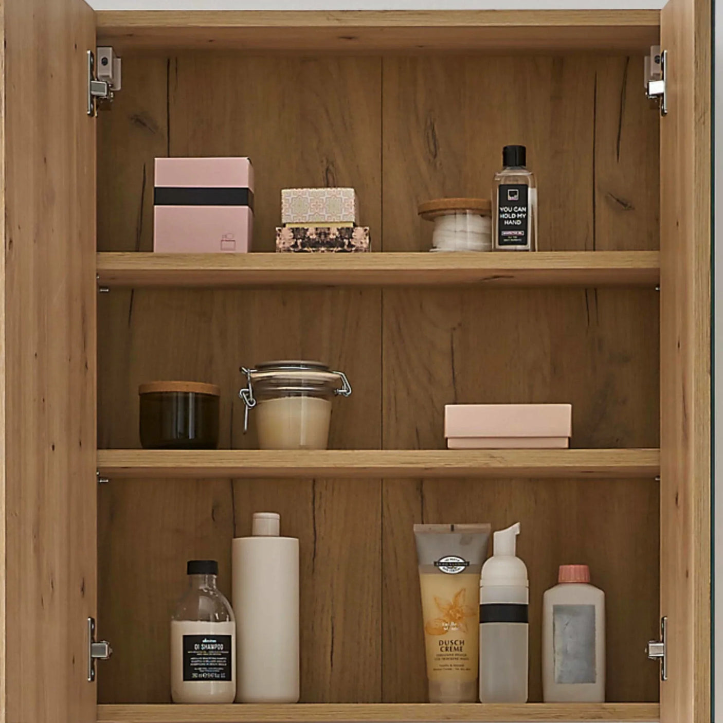 Oak bathroom cabinet with toiletries and storage jars on three open shelves