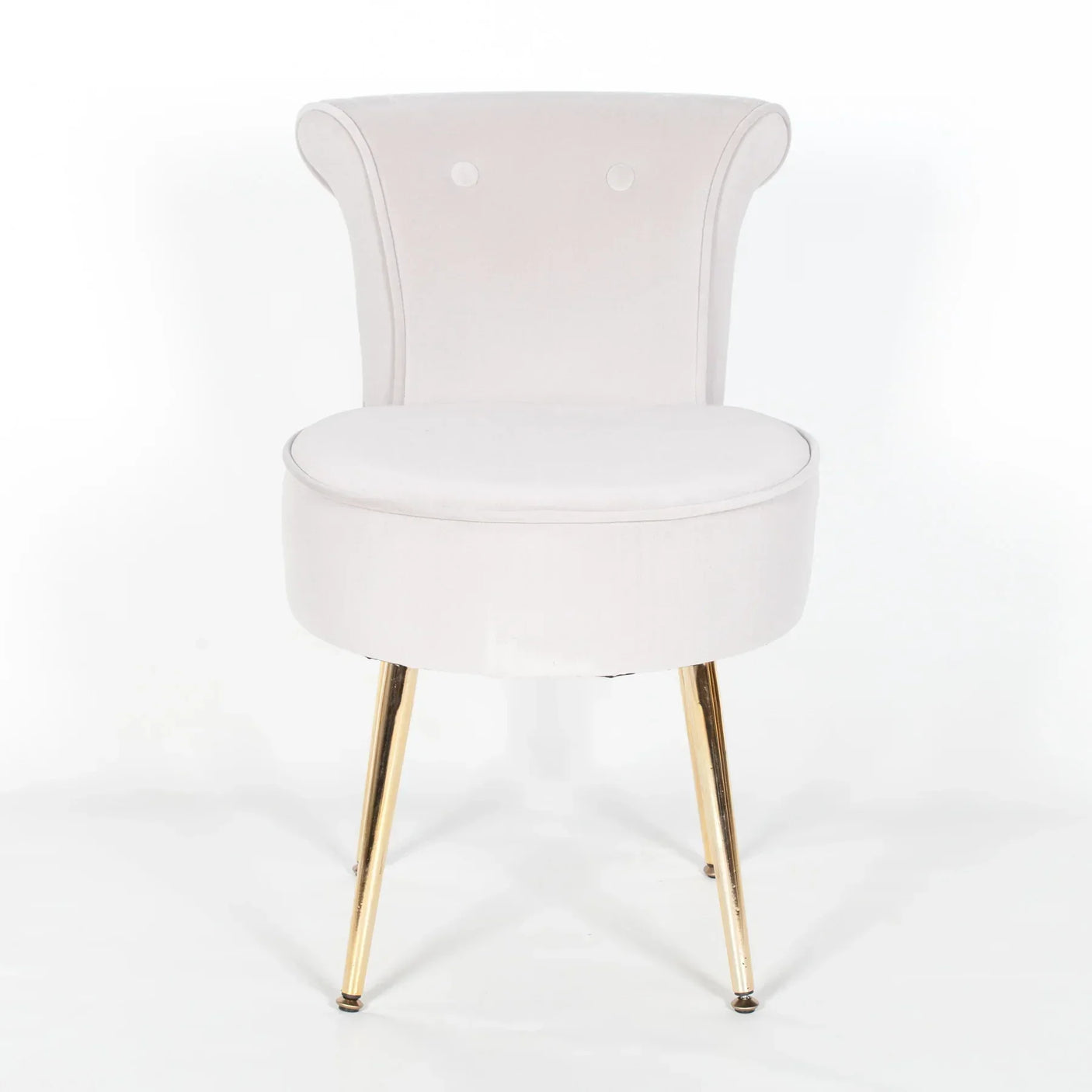 White accent chair with curved backrest and gold metal legs, front facing angle