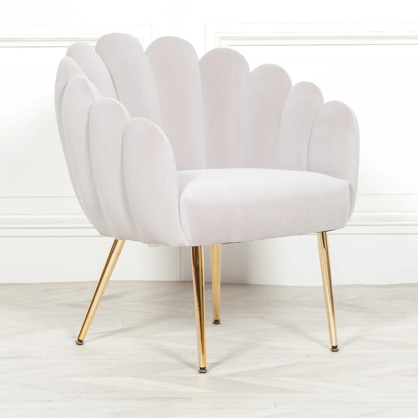 scallop shell accent chair with pale grey velvet upholstery and gold metal legs