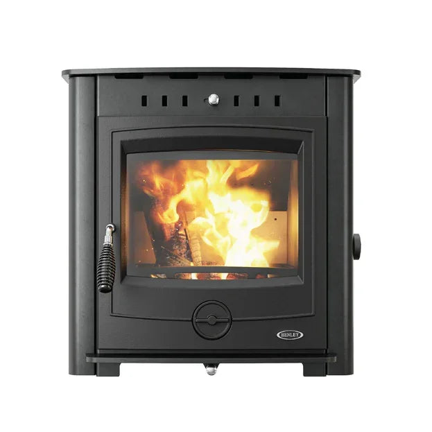 Black eco boiler stove with glass door showing burning firewood inside, front view
