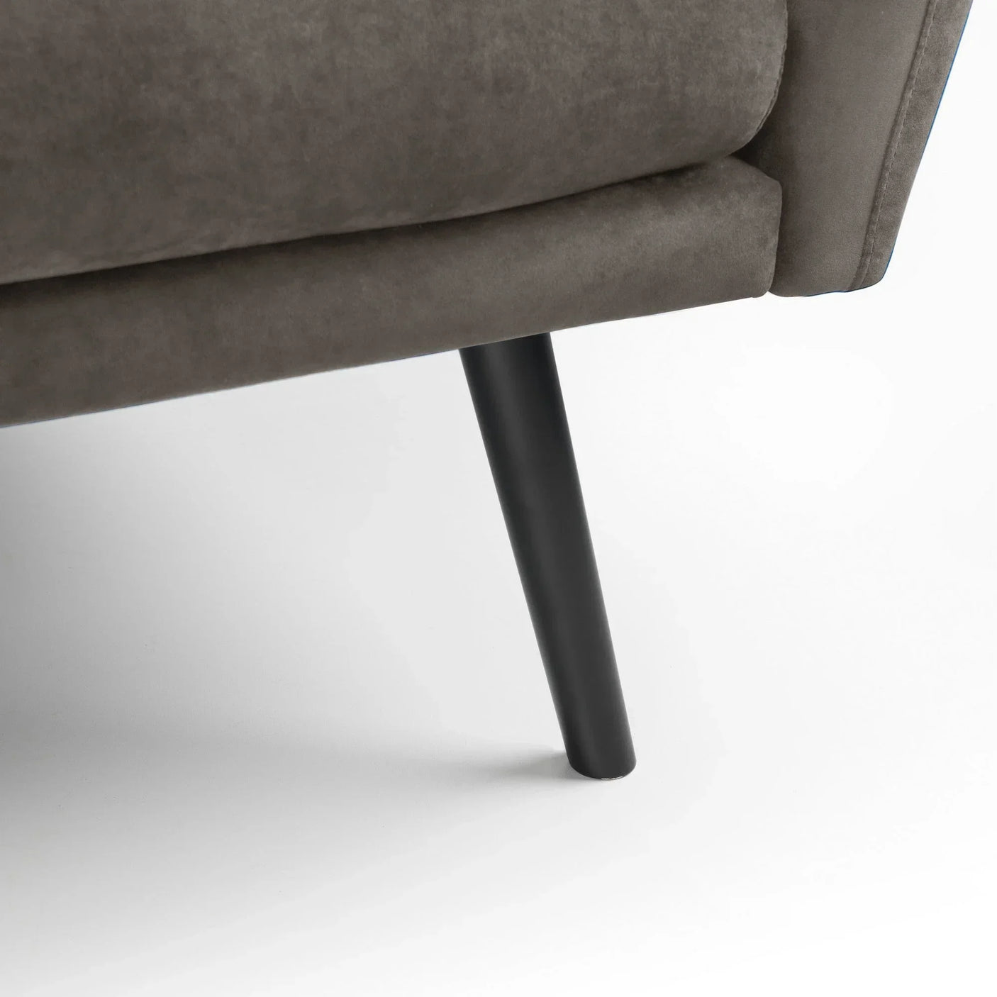 Afina grey sofabed close-up showing black tapered leg and fabric upholstery