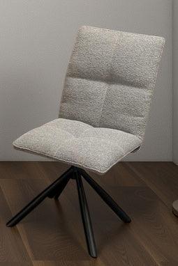 Grey fabric Alba chair with padded seat, black metal swivel base on wooden floor